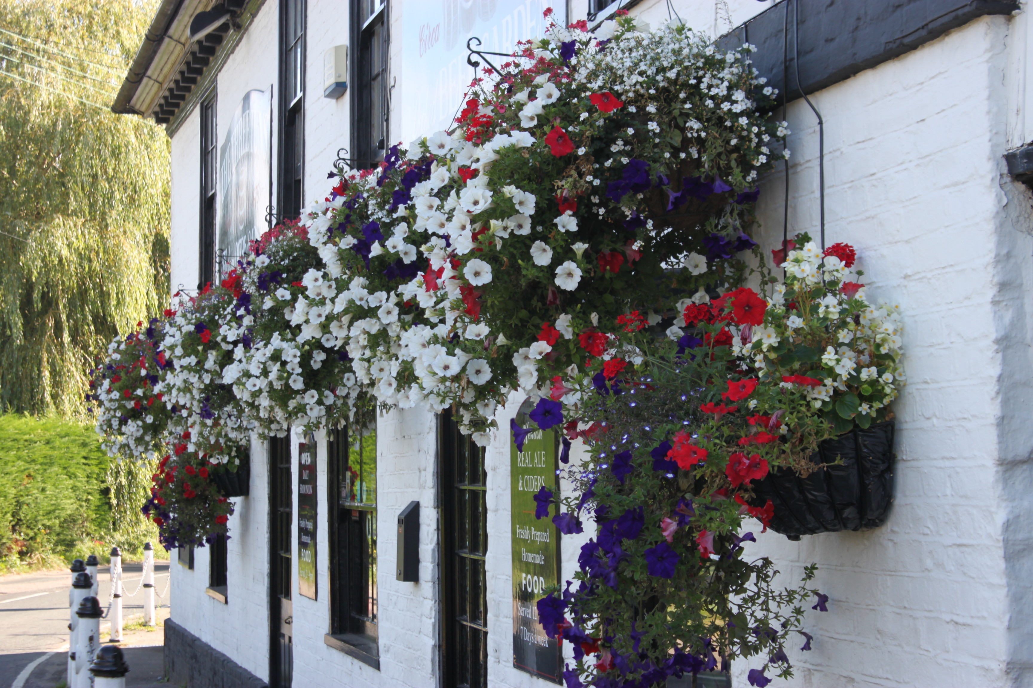 three-tuns-exterior-building-hanging-baskets.jpg